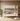 White bunk bed in a room with a plant and rug